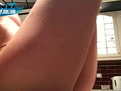 Blonde camgirl fucks dildo in kitchen
