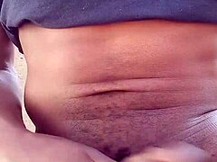 Moaning while stroking big black cock outdoors