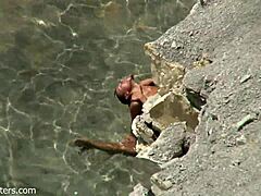 Beach Couple's Bold Intimacy