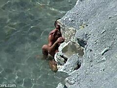 Beach Couple's Bold Intimacy