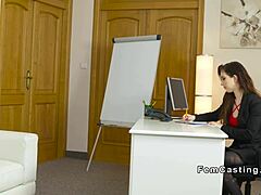 female agent offers face sitting to model on sofa