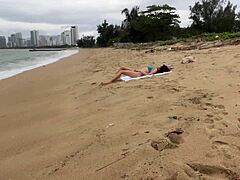 Babe flashes cock in public and begs for cum on tits at beach.