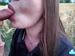Blowjob unfolds in a quiet wheat field.
