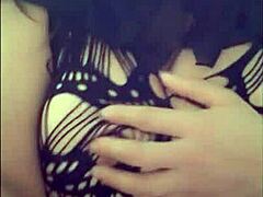 Masked Halloween lady models erotically while touching herself