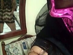 Masked Halloween lady models erotically while touching herself
