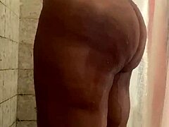 Buttah gets soaking wet in steamy shower scene.