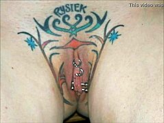 Crystal Butterfly flaunts intricate tattoo while rocking out to intense music vibes