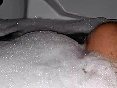 Watch me jerk off in the hot tub with relaxing music and foam all over my cock!