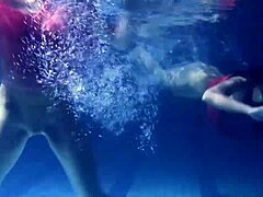 Lilia Mihalkova and Natalia Kupalka dive into underwater lesbian play in the pool