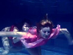 Lilia Mihalkova and Natalia Kupalka dive into underwater lesbian play in the pool