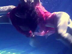 Lilia Mihalkova and Natalia Kupalka dive into underwater lesbian play in the pool
