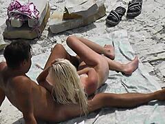 Watch this voyeur slim blonde jerk her boyfriend at the nudist beach