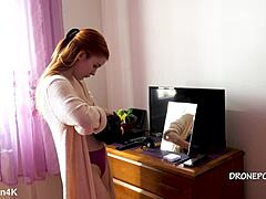 Beautiful naked redhead karolinka applies makeup while posing