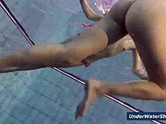 these horny czech girls start stripping each other down in the pool, getting all nude and playful underwater in their bikinis
