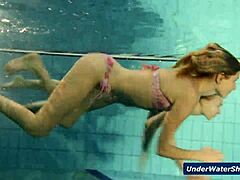 these horny czech girls start stripping each other down in the pool, getting all nude and playful underwater in their bikinis