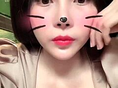 Asian girl shows off big tits in sexy live session