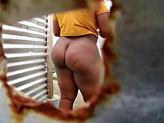 I feel so drawn to this amateur camera view of a voluptuous figure in the beach cabin, changing dress in the bath.