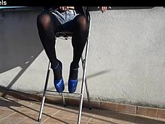 Those denim shorts paired with black tights and these gorgeous 8-inch heels look so hot on her.