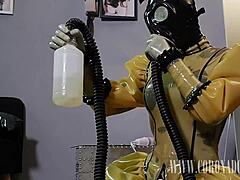 she layered up in three layers of latex and four layers of gloves, then added a gasmask for intense self-bondage play