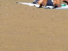 Pink princess struts on the beach with hidden candid vibes, contrasting her ass against the waves in intriguing princess style.