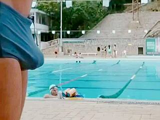 hint of a thick cock in tight swimwear at the pool