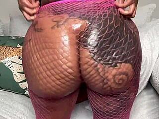 Pink fishnets on ebony ass demand fierce twerking