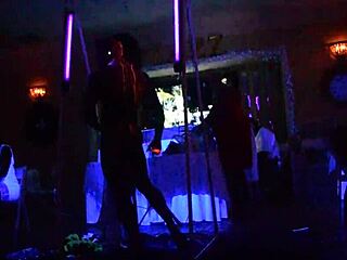 Male stripper shines for milfs in dark