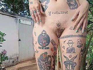 TATTOOED VIXEN STRIPS BARE