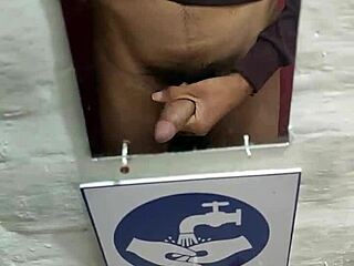 Young Guy Strokes Cock In Restaurant Bathroom