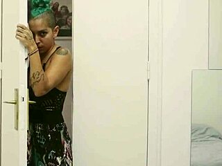 Short Tattooed Girl Strips with Green Hair Flair