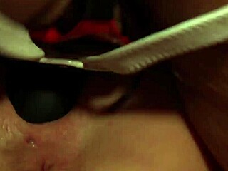 Paige Ashley grabs a black strapon to pound Scarlett March in bed.
