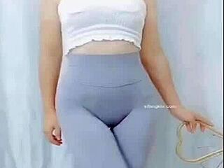 Hey, watch this Asian girl groove with a sexy cameltoe on display.