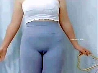 Hey, watch this Asian girl groove with a sexy cameltoe on display.