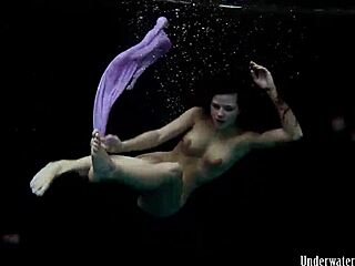 Aneta flaunts big tits in purple dress underwater in pool