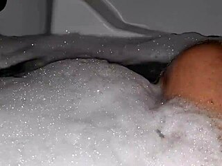 Watch me jerk off in the hot tub with relaxing music and foam all over my cock!