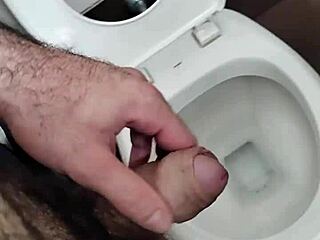 Hey dude, check out this guy jerking his small cock in the public bathroom solo