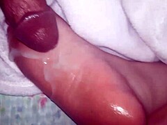 Hot cumshot lands on my oiled feet, dripping slowly