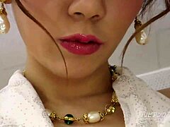 The asian girl shows her big tits in the bubble bath story.