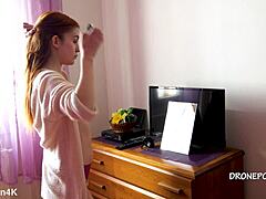 Beautiful naked redhead karolinka applies makeup while posing