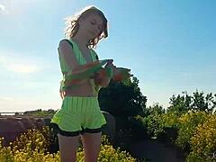 why don't you watch this spunky teen model strip naked outdoors, showing off her cute tits?