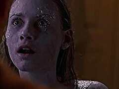 In a steamy Smallville episode, blonde actress Tania Saulnier strips nude for her sexy shower scene, revealing alluring curves.