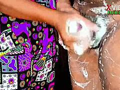 in a close-up homemade scene, the wife gives a handjob with soap leading to cumshot on her.