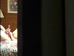 peeping tom spies amateur milf masturbating in hotel room through open window