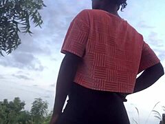 crazy woman twerking partially clothed in a dense forest setting