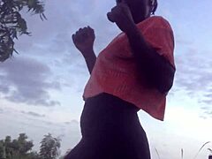 crazy woman twerking partially clothed in a dense forest setting