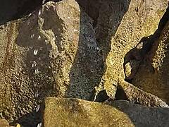 nina black horny shaved pussy public outdoor peeing by crashing sea waves