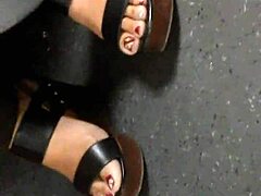 mature feet hidden in candid wedge sandals tease secretly