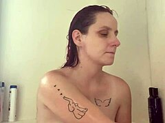 shower water cascades over my shaved ass as i finger myself to retro blue film ecstasy