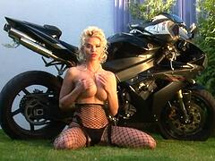 Blonde bombshell caylian curtis teases big tits fishnets solo biker glamour dream