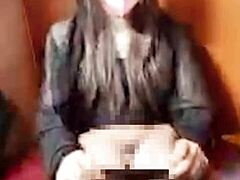 this quiet japanese ladyboy jerks off silently on cam hiding moans during intense solo masturbation